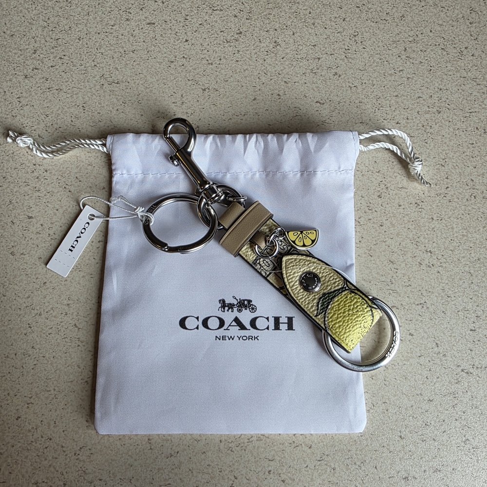 NWT Coach Trigger Snap Bag Charm With Lemon Print With Dust Bag!!